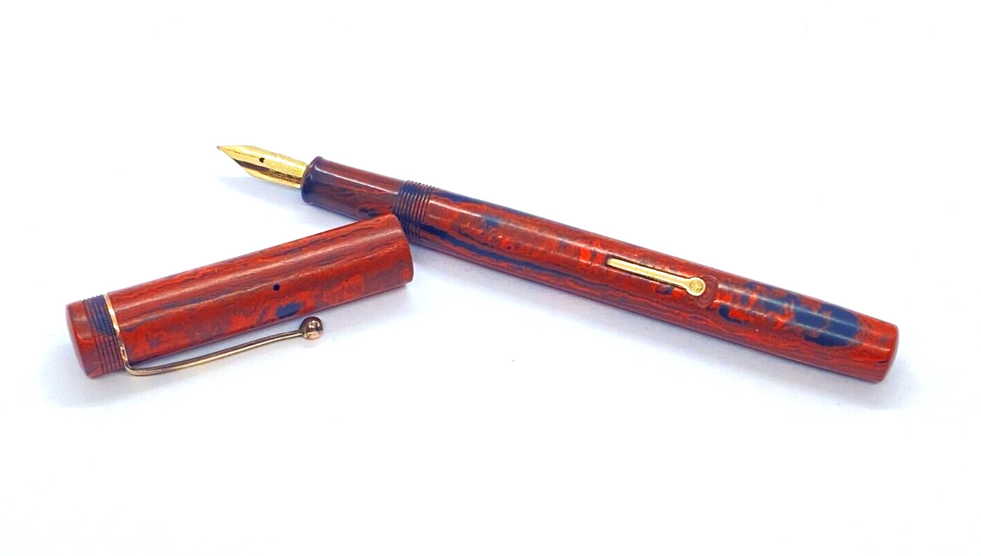 THE CONWAY STEWART FOUNTAIN PEN IN RED MOTTLED SPRINGY 14K MEDIUM NIB