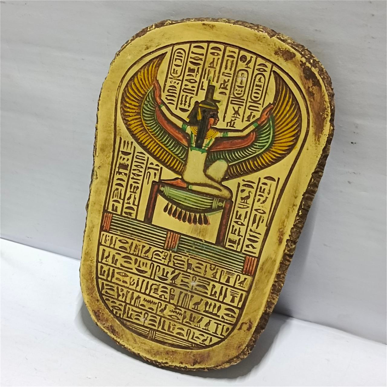 Hand-carved ancient Egyptian wall plaque featuring Queen Isis in antique style