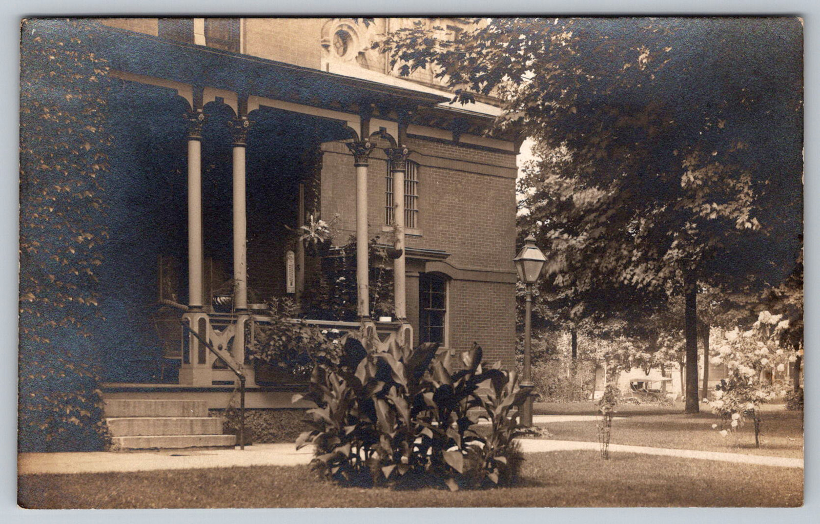 RPPC c1910s High Victorian Brick Mansion Christmas Albion Michigan Postcard