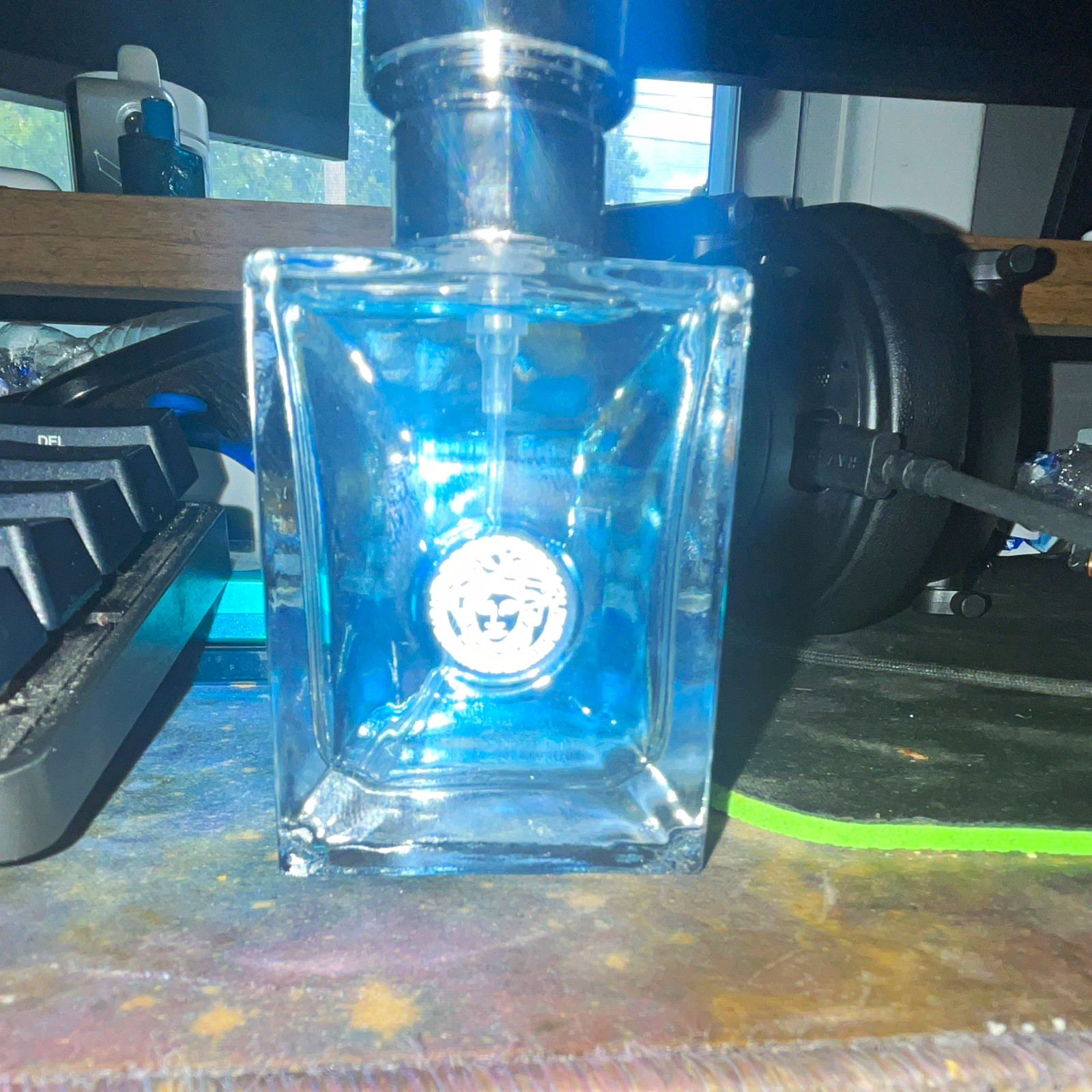 Versace Pour Homme Perfume Bottle with Medusa Emblem and Cap