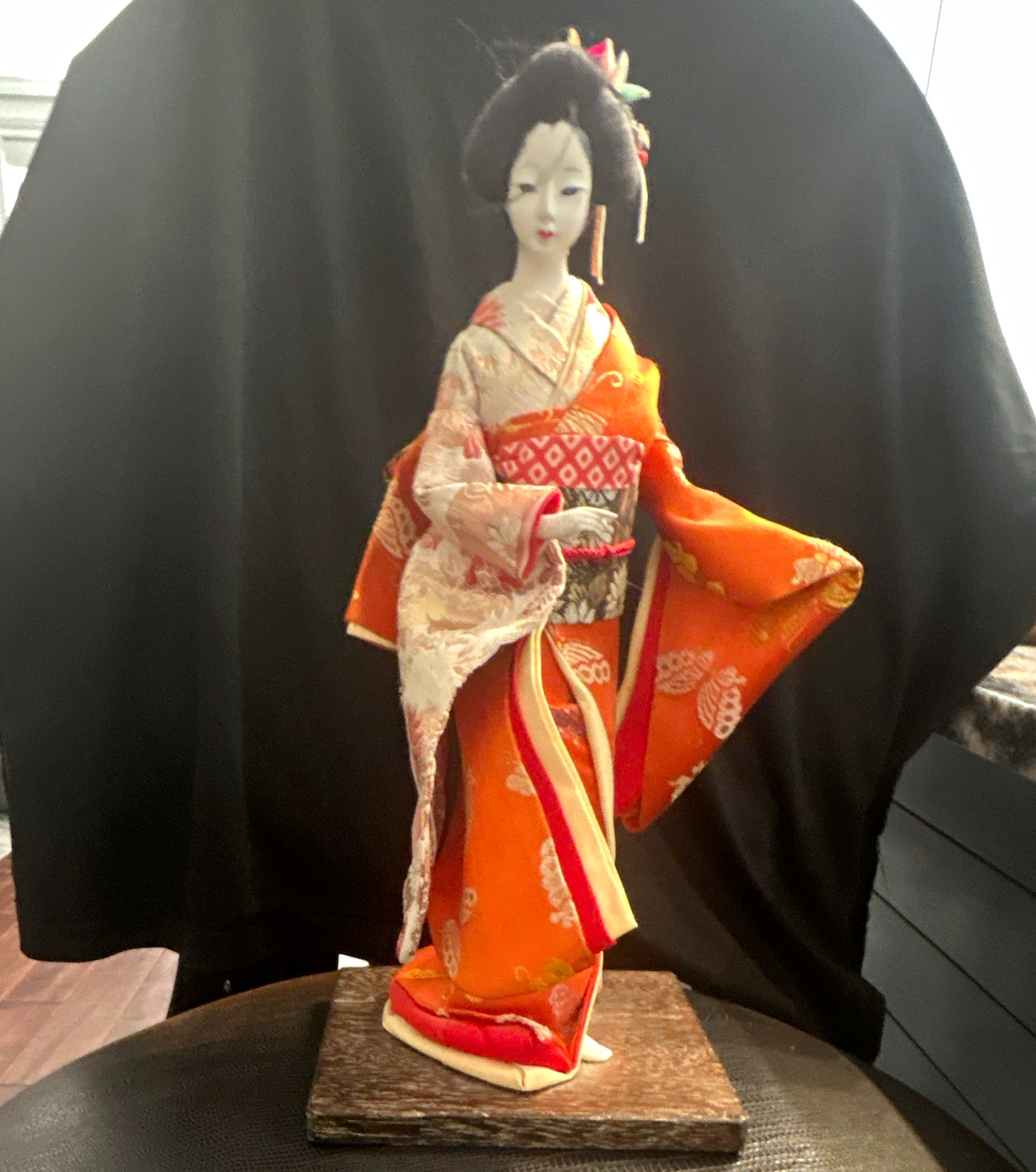 Vintage Japanese Geisha Doll Orange Kimono on Wooden Stand.