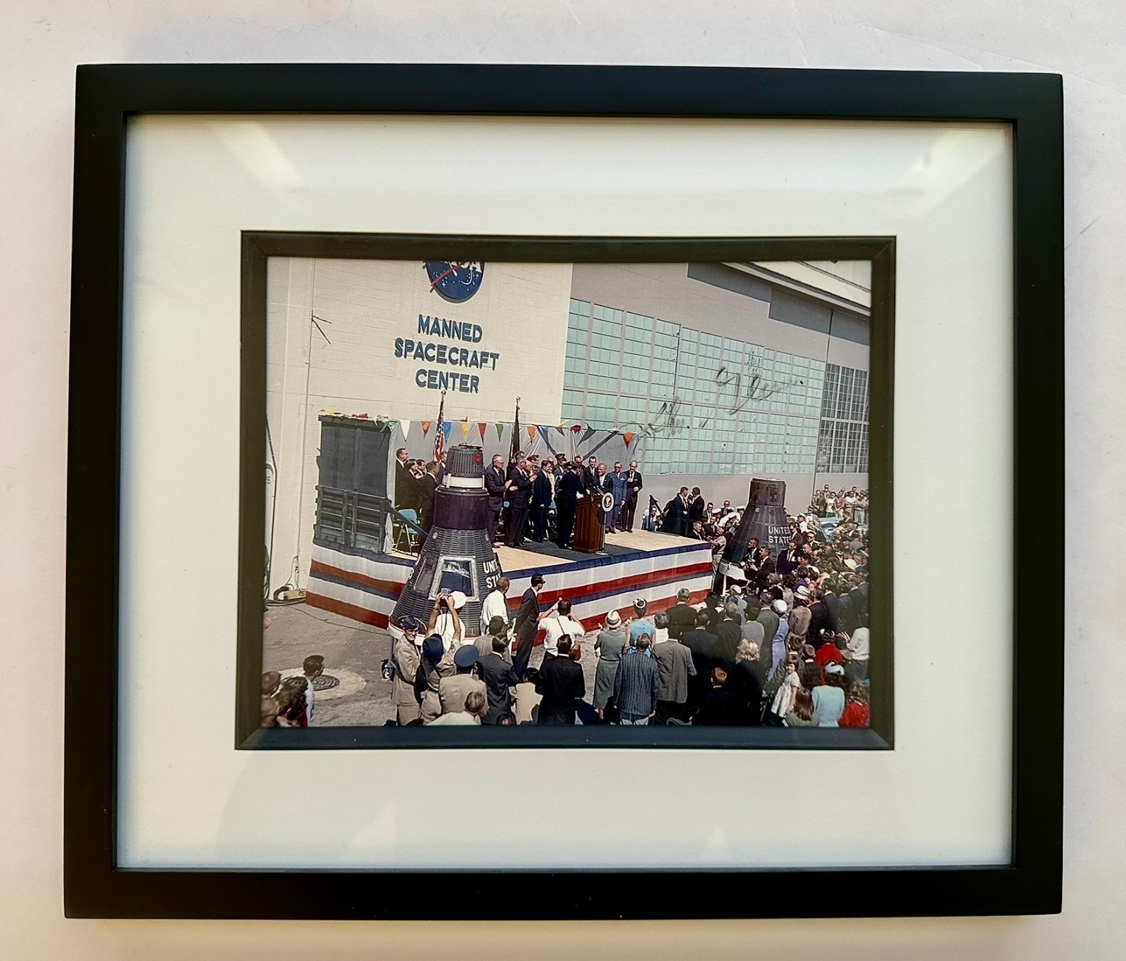 Autographed by John Glenn  photo of JFK on stage with Apollo mission astronauts