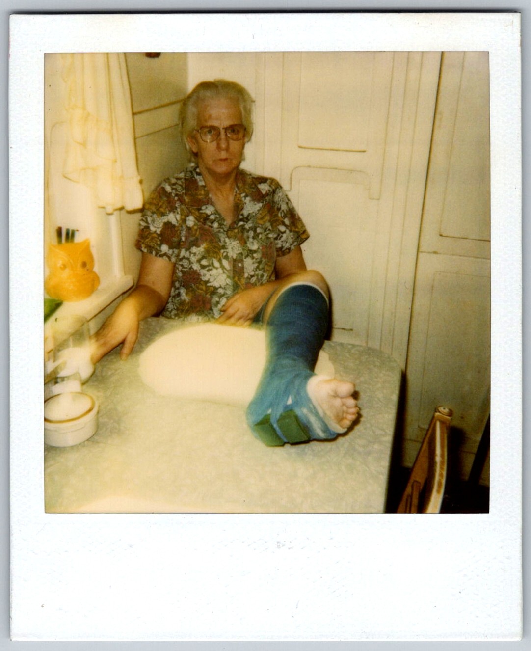 Vtg Polaroid Snapshot Photo Elderly Woman Leg Cast Resting On Table 1999