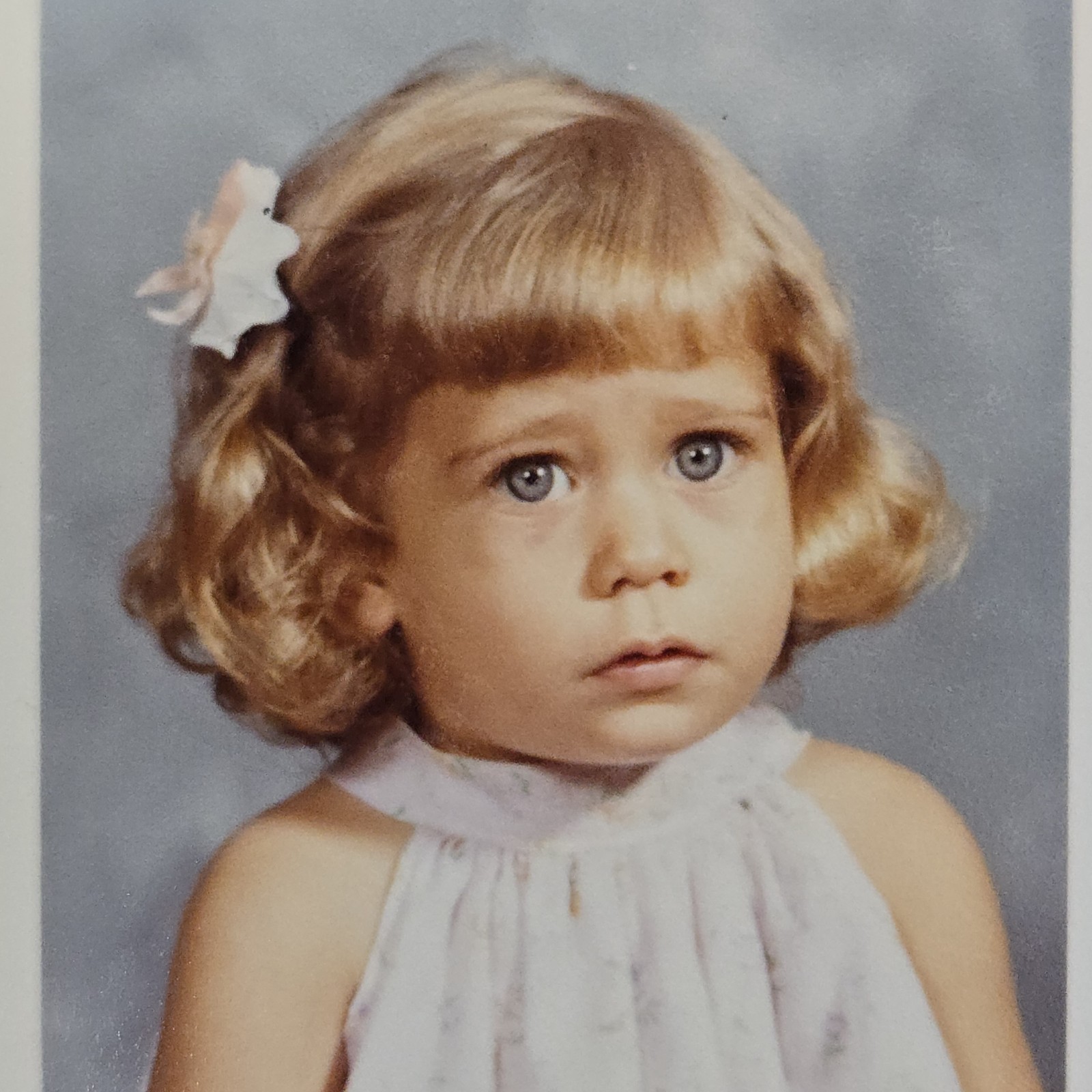 Small Color Photograph of Sad Looking Young Girl | Big Blue Eyes Blonde Hair