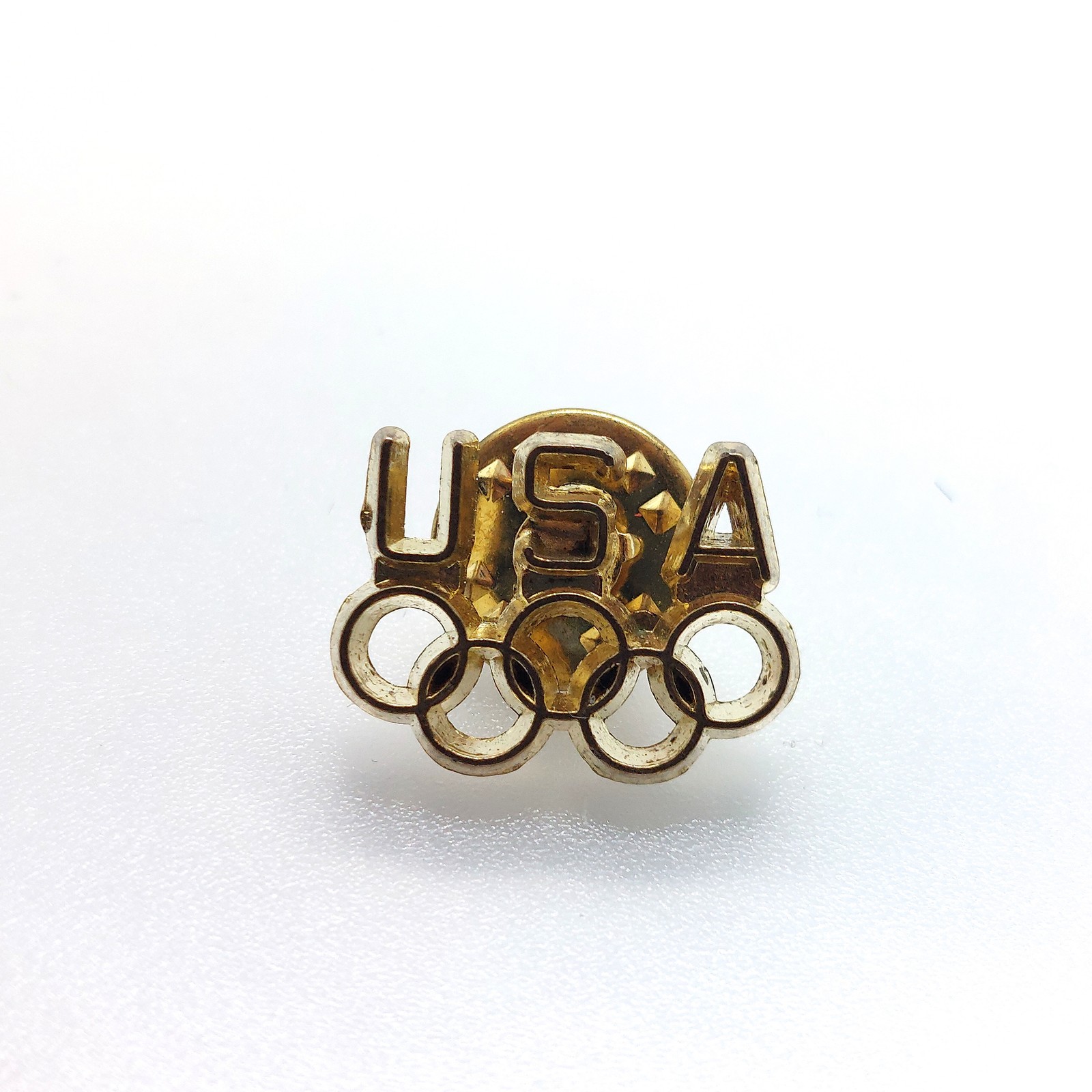 Vintage USA Olympic Rings Lapel Pin Team Cutout Letters Star Accents Sports Fan