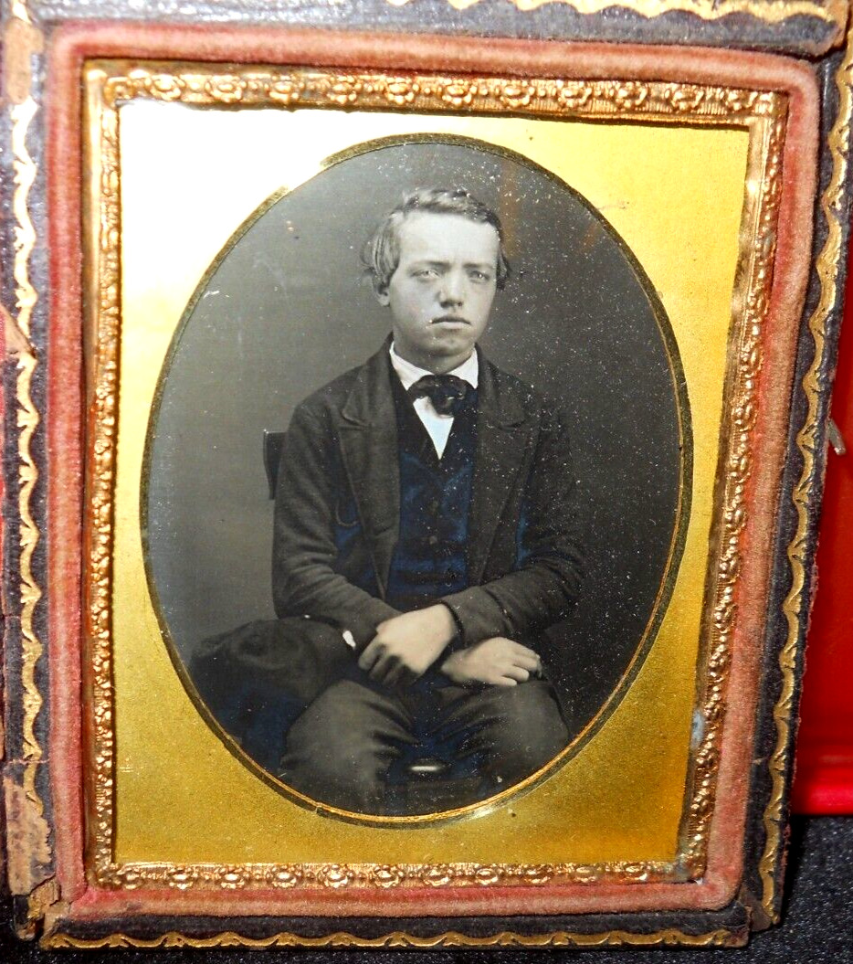 1/9th size Daguerreotype of young man in half case