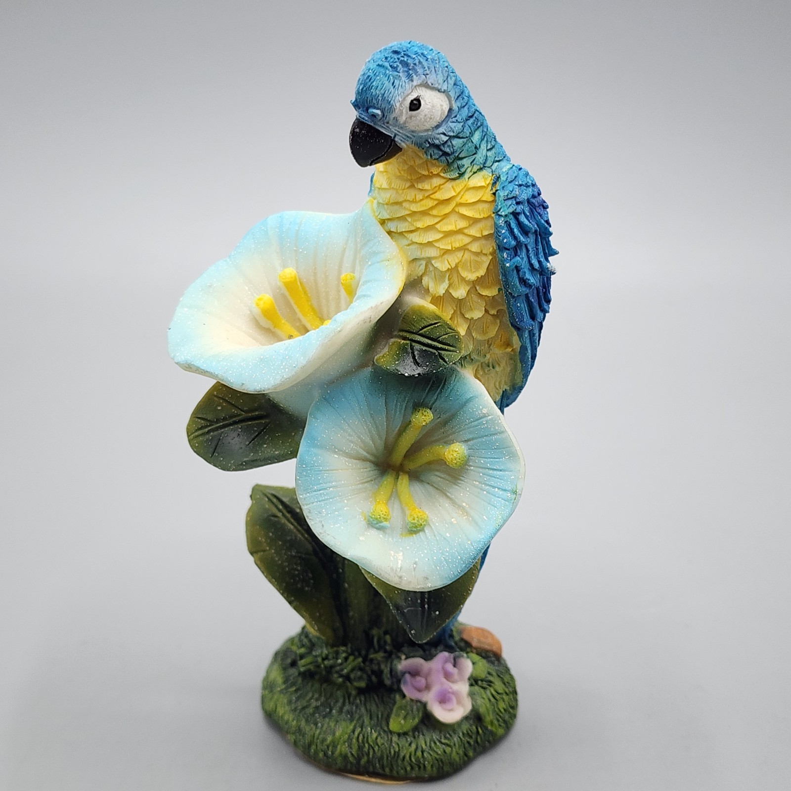 Blue And Yellow Macaw Perched On Flowers Figure