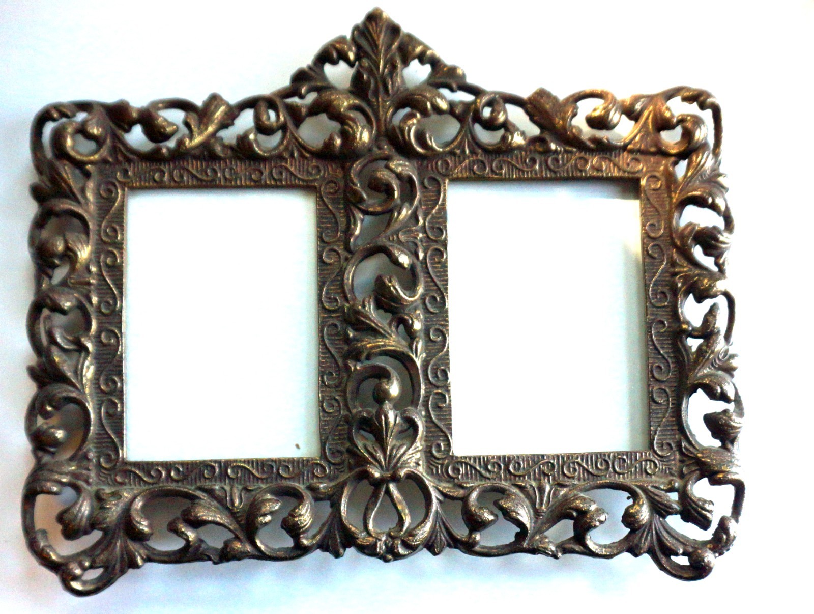 Beautiful vintage double picture frame featuring an elegant, ornate Rococo/Bar Beautiful vintage double picture frame featuring an elegant, ornate Rococo/Bar