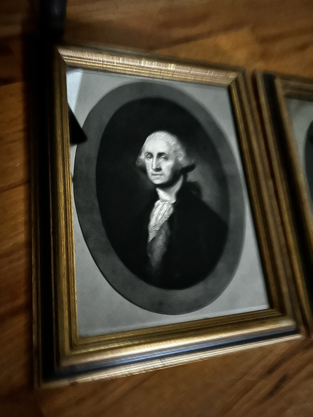 Framed chromolithographic canvas portraits of George and Martha Washington