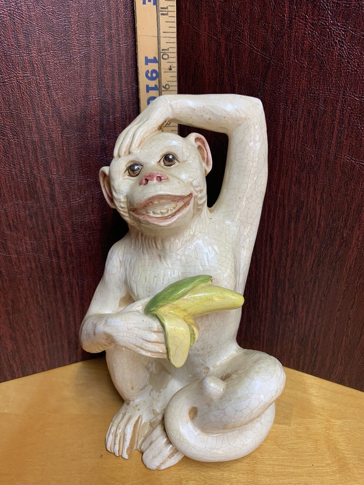 Vintage Italian White Glazed Ceramic Monkey Holding Banana Scratching Head 9 In