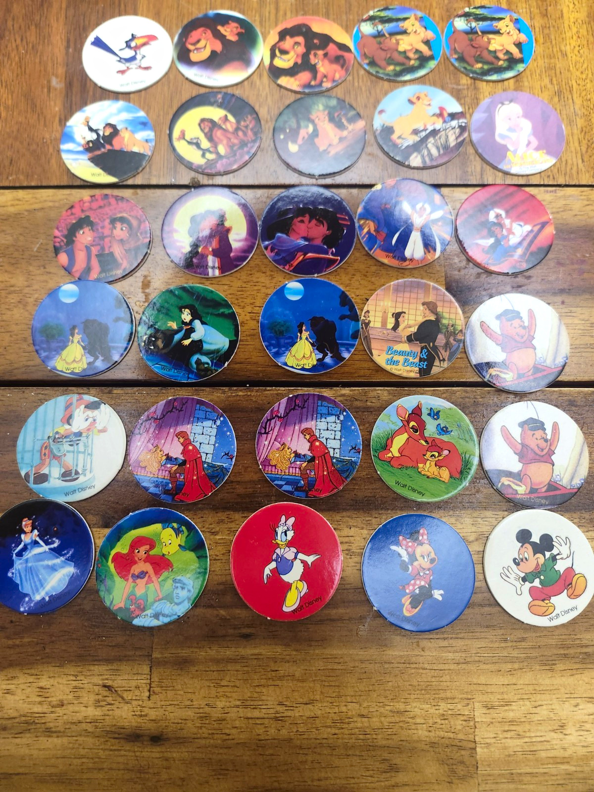 30 Vintage Walt Disney Pog slammer Lion King, Beauty and the beast, and Alladin.