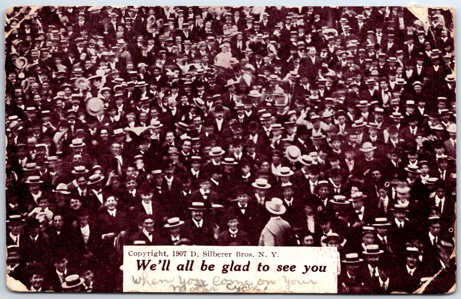 VINTAGE POSTCARD 'WE'LL ALL BE GLAD TO SEE YOU' NOVELTY HAPPY CROWD 1908 creases
