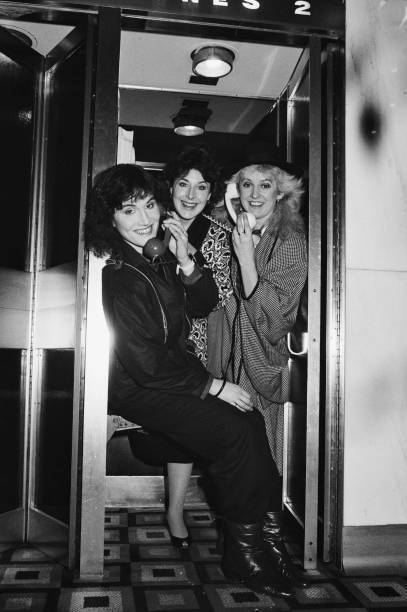 Fascinating Aida pose together in a telephone booth, 26th January 1 - Old Photo