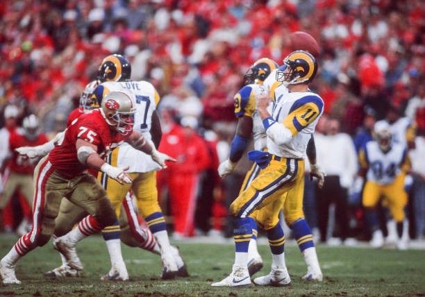 Jim Everett Los Angeles Rams attempts a pass during a National Foo- Old Photo
