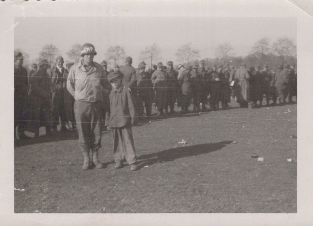 WW2 Theodore Speiser 1945 US soldier with boy Germany crowd 1945 Rare Photo