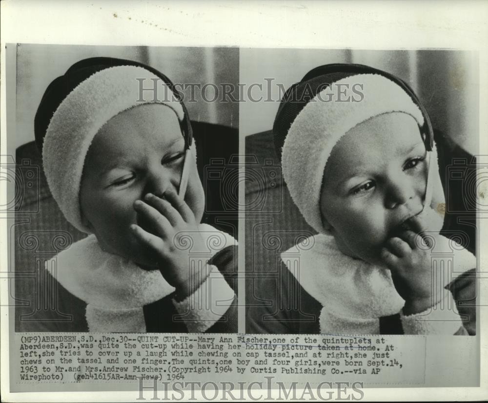 1964 Press Photo Mary Ann, one of the Fischer quintuplets chews on cap tassel