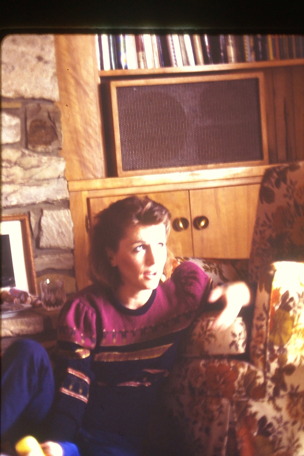 c1980\'s Kodachrome 35mm Slide Woman Magenta Sweater Floral Armchair Bookshelf