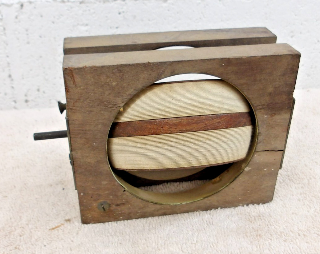Antique 1920s wooden radio variometer tuning component.