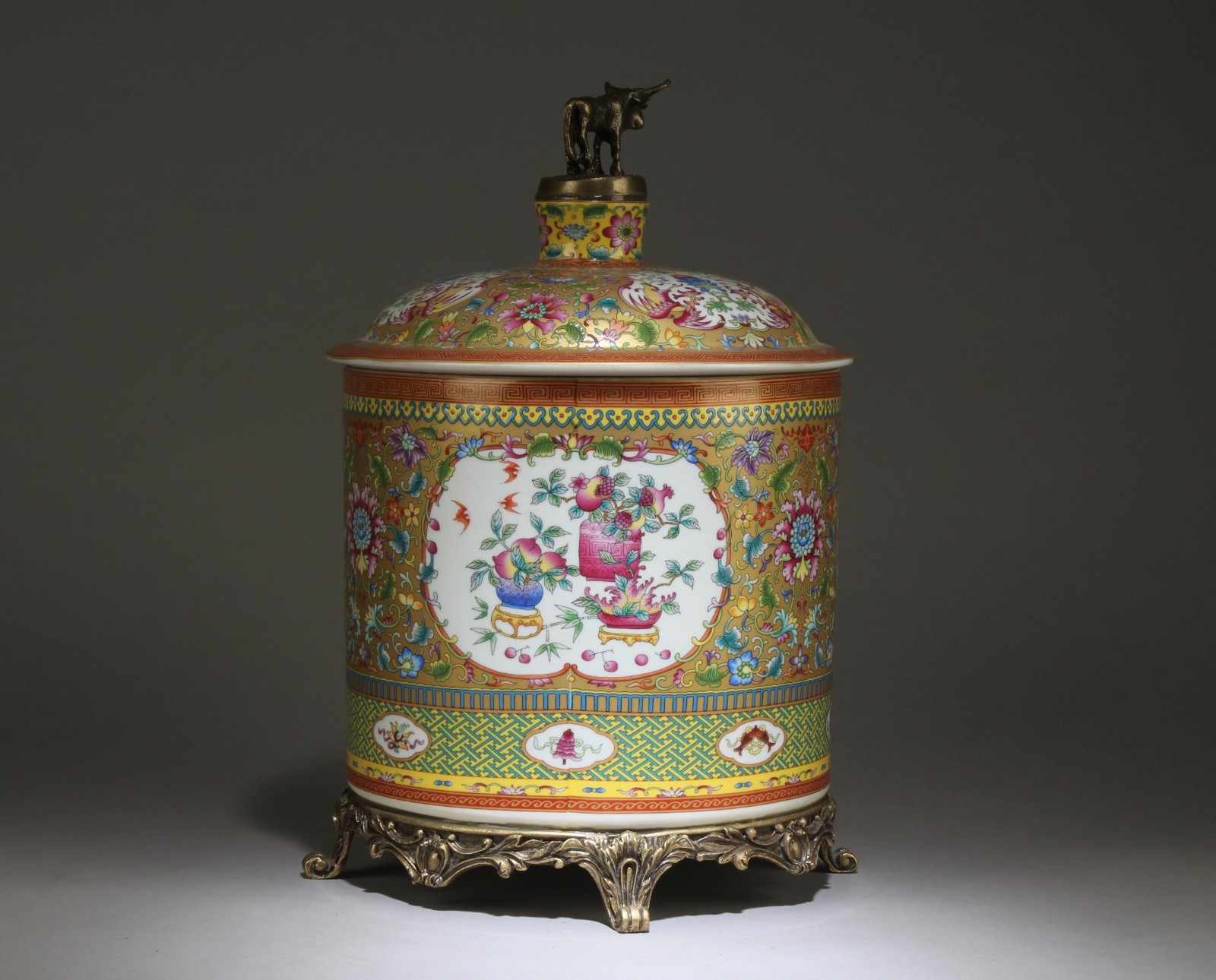 A Chinese Famille Rose Jar with Bronze Decorations