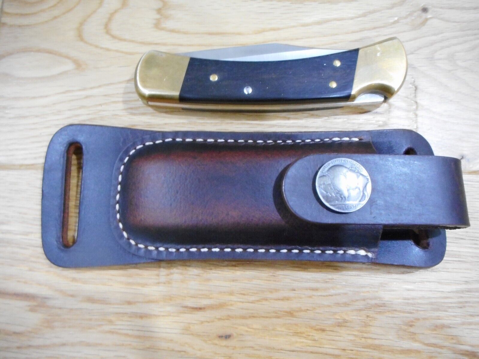 Buck 110 Horizontal draw leather knife sheath .  Crazy Horse Brown leather.