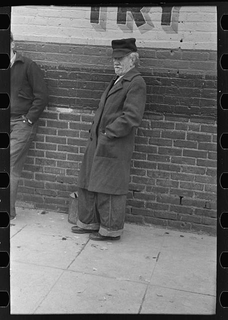 Photo:Williston North Dakota 1910s Farmer Man in Overcoat by Brick Wall
