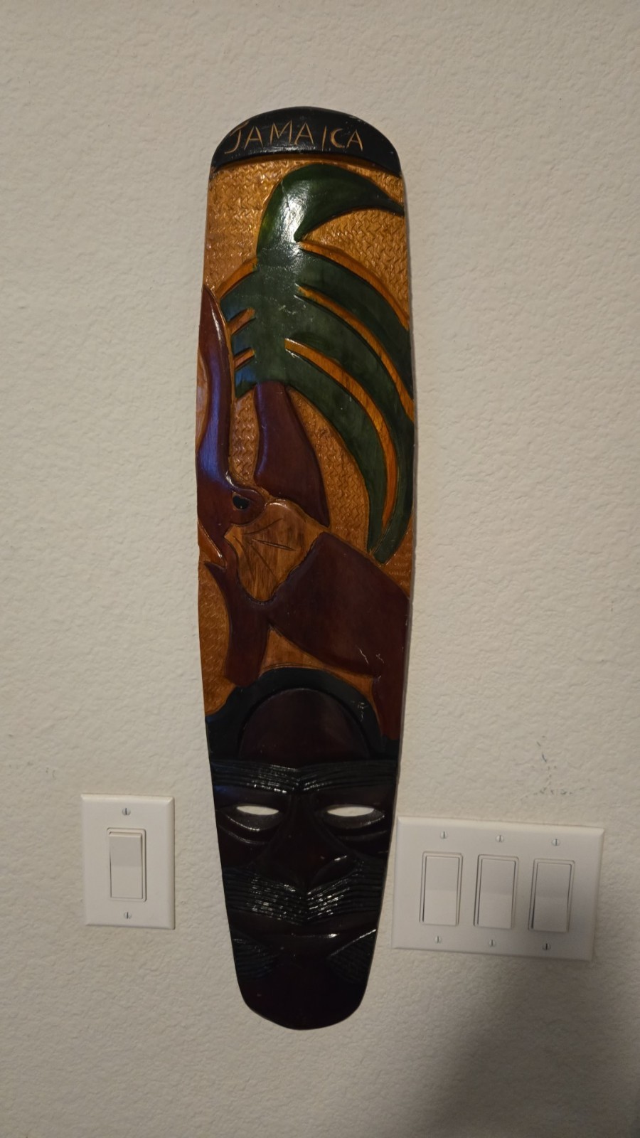 vintage, hand-carved, and painted wooden wall mask from Jamaica
