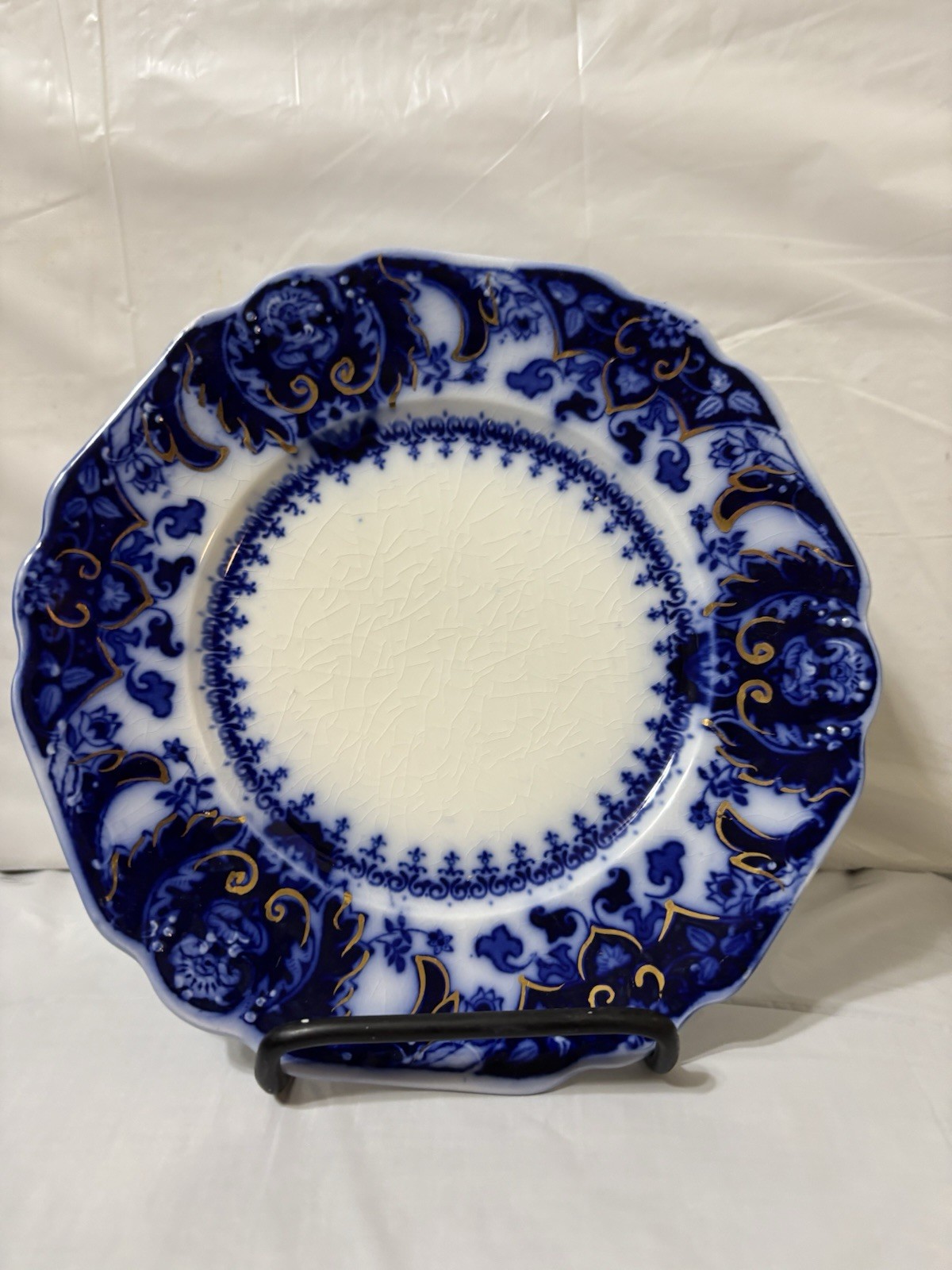 Flow Blue porcelain plate with gold accents in the “Florida” pattern. Flow Blue porcelain plate with gold accents in the “Florida” pattern.