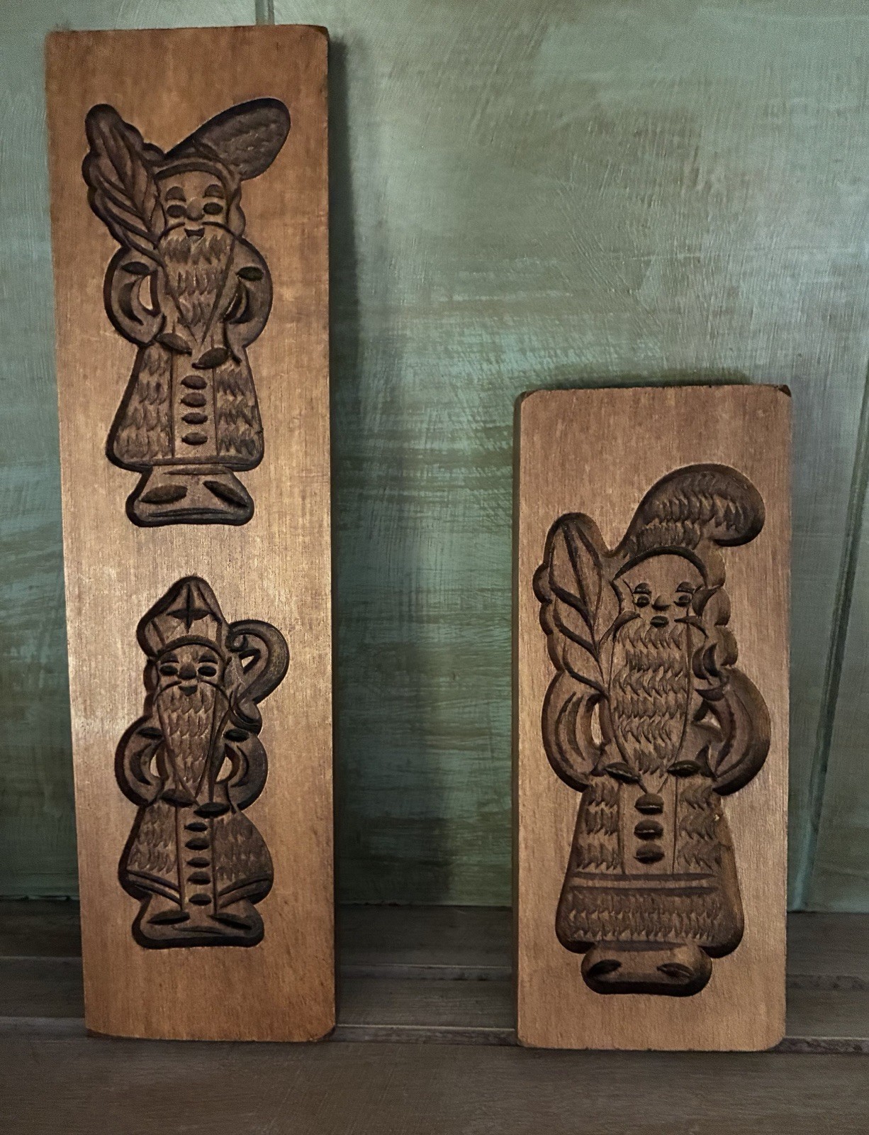 Two vintage wooden cookie molds featuring carvings of St. Nicholas