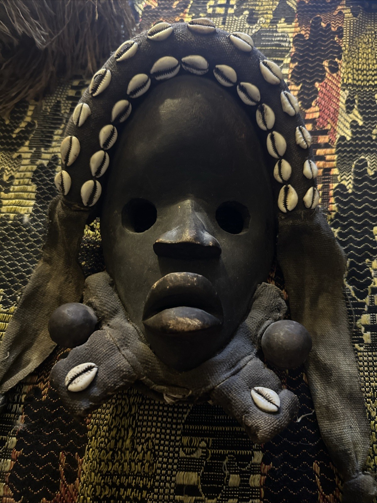 OLD AFRICAN DAN-STYLE CARVED WOOD MASK WITH COWRIE-SHELL TEXTILE HEADDRESS