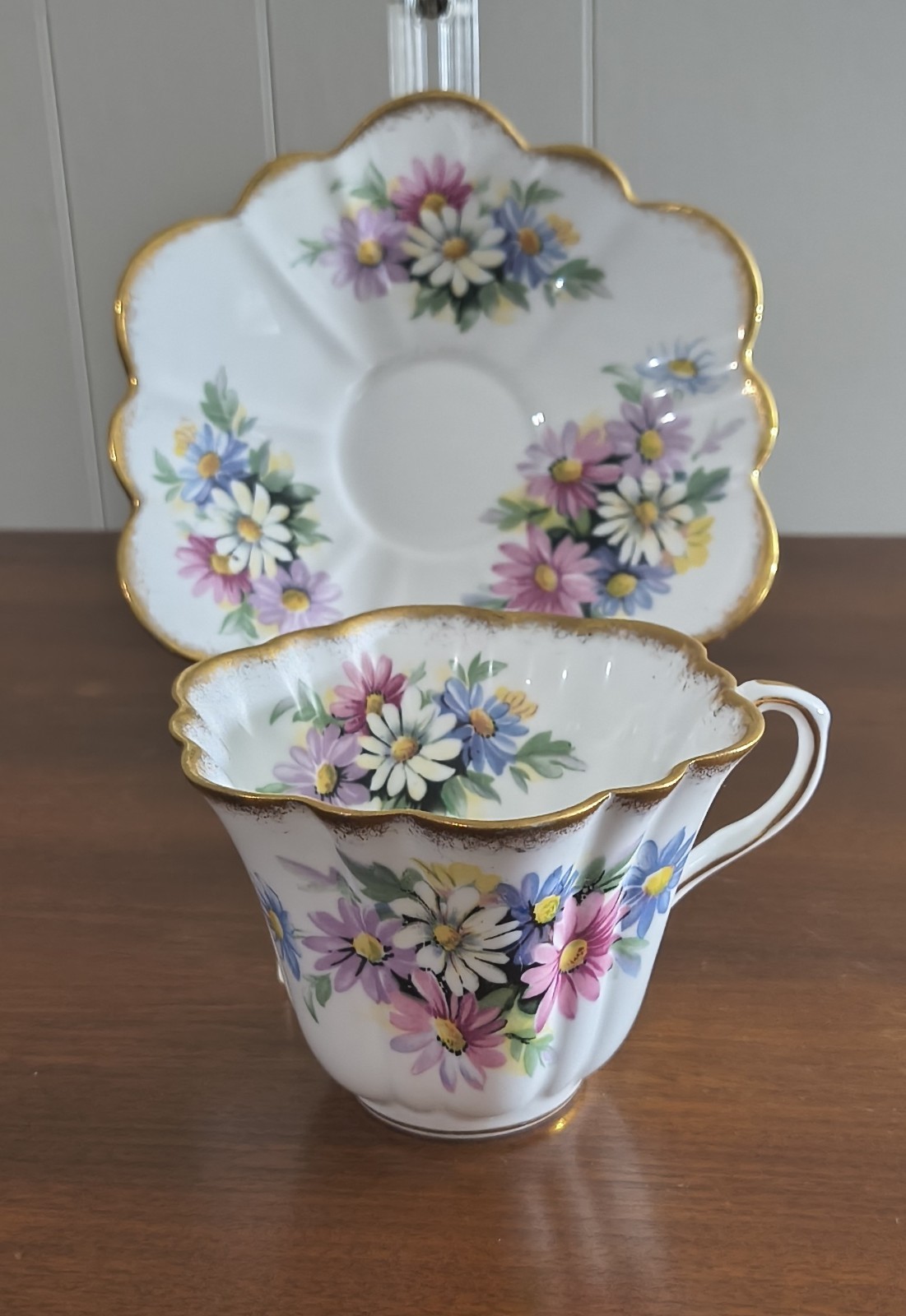Rosina White Teacup & Saucer with Multi-Color Daisies & Gold Gild Trim   England