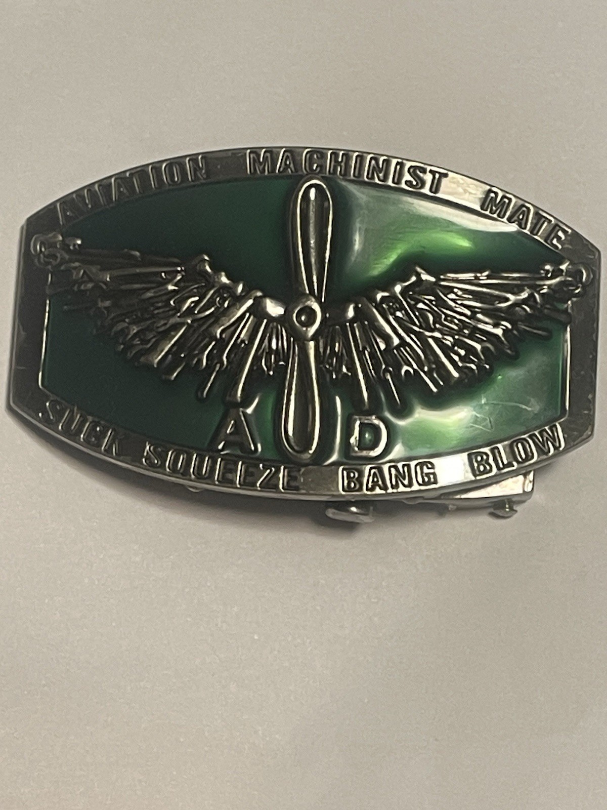US NAVY Aviation Machinist Mate Belt Buckle Suck, Squeeze Bang Blow