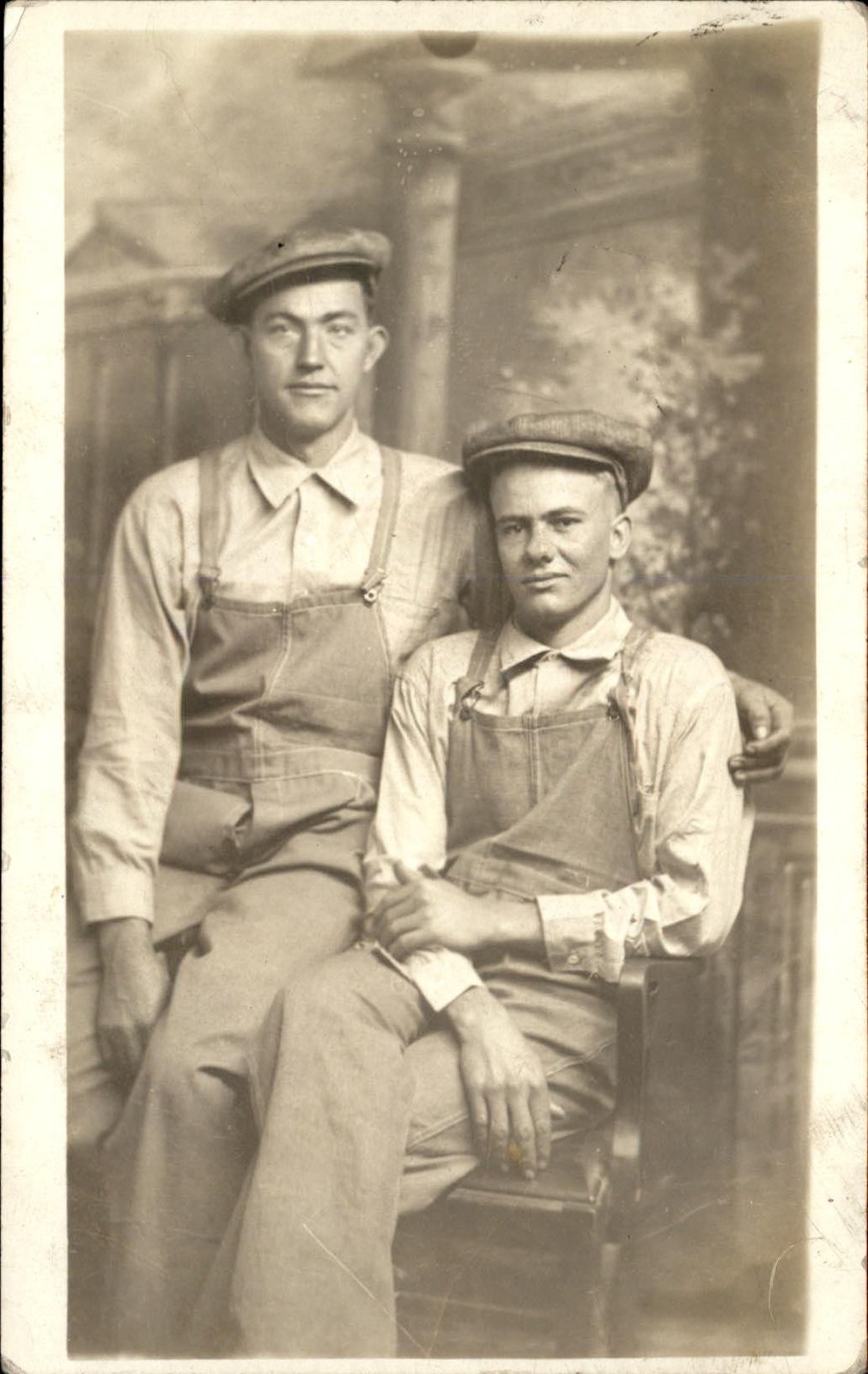 Two young men in caps & Denim Overalls Walper Studio Boston c1910s RPPC bhn
