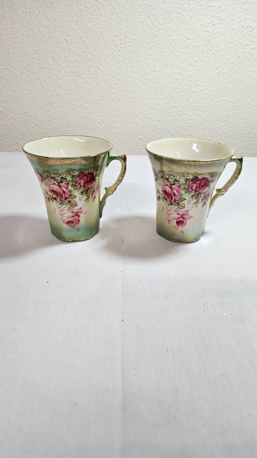 Antique hand painted tea cup pair