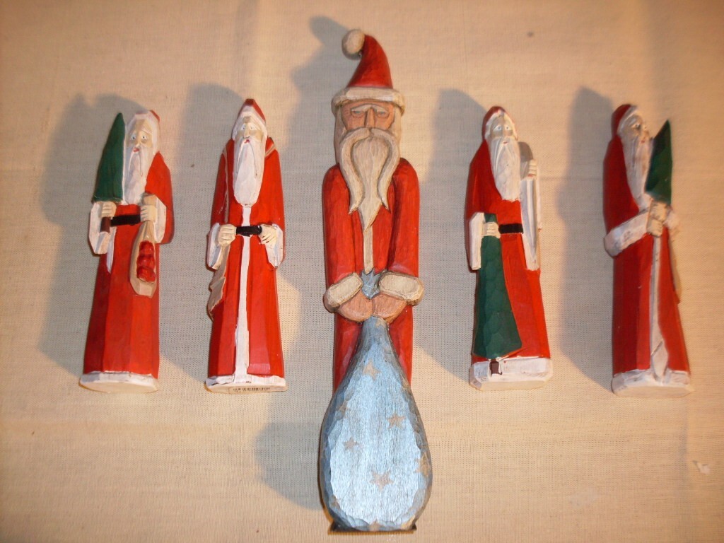 Folk Art Carved Santa Figures. Unique, hand-crafted, solid wood, varied poses. Folk Art Carved Santa Figures. Unique, hand-crafted, solid wood, varied poses.