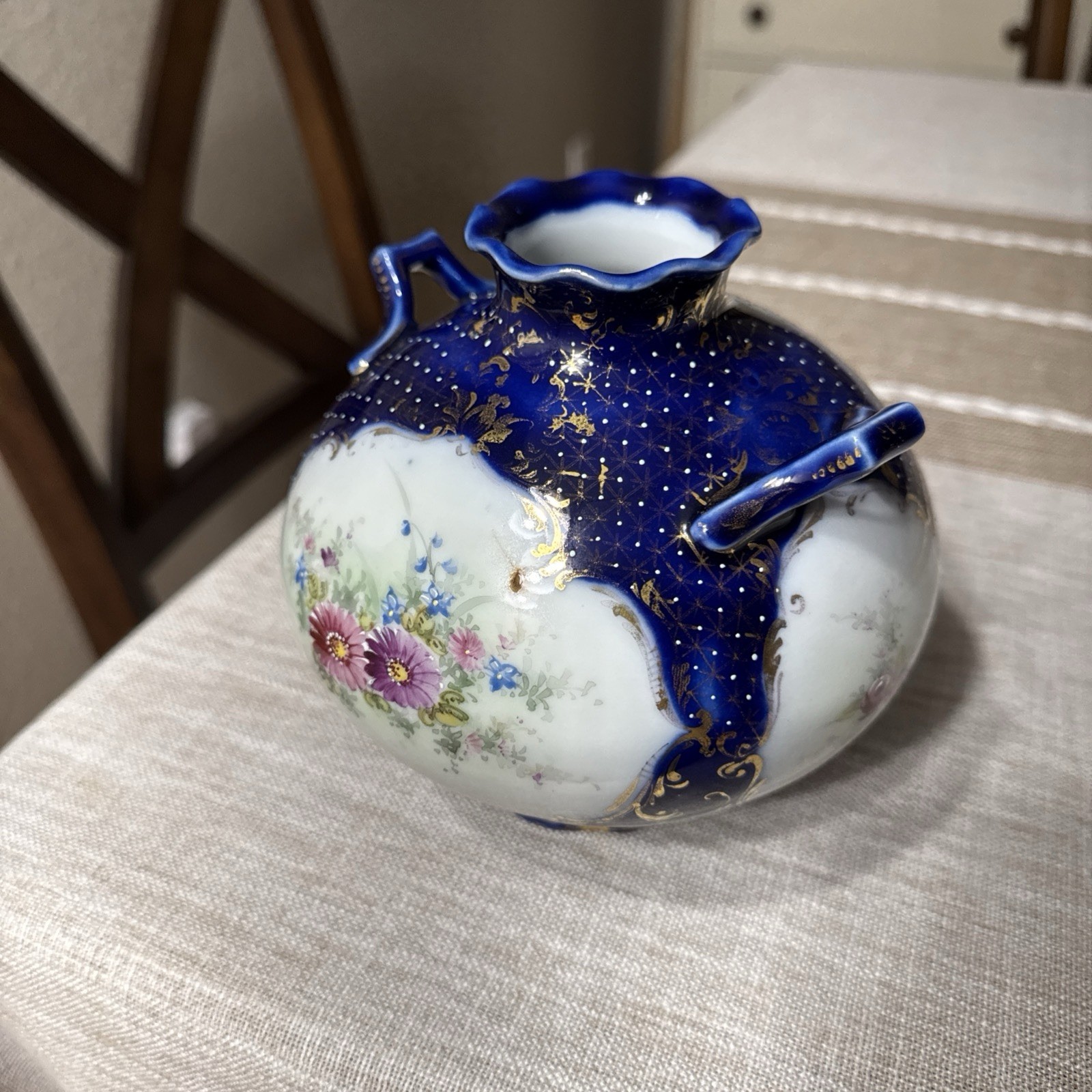 Cobalt blue antique porcelain vase featuring hand-painted floral details Cobalt blue antique porcelain vase featuring hand-painted floral details