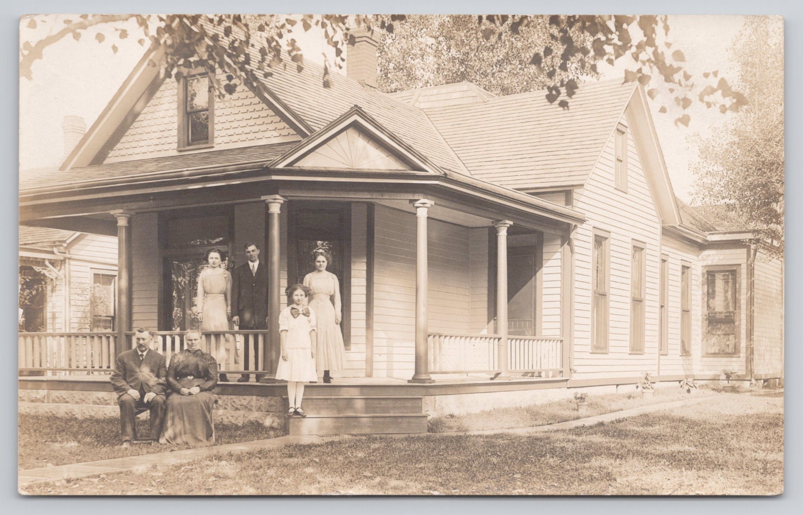 RPPC People Family Girl Large Bow House on Porch c1904-1918 Real Photo Postcard