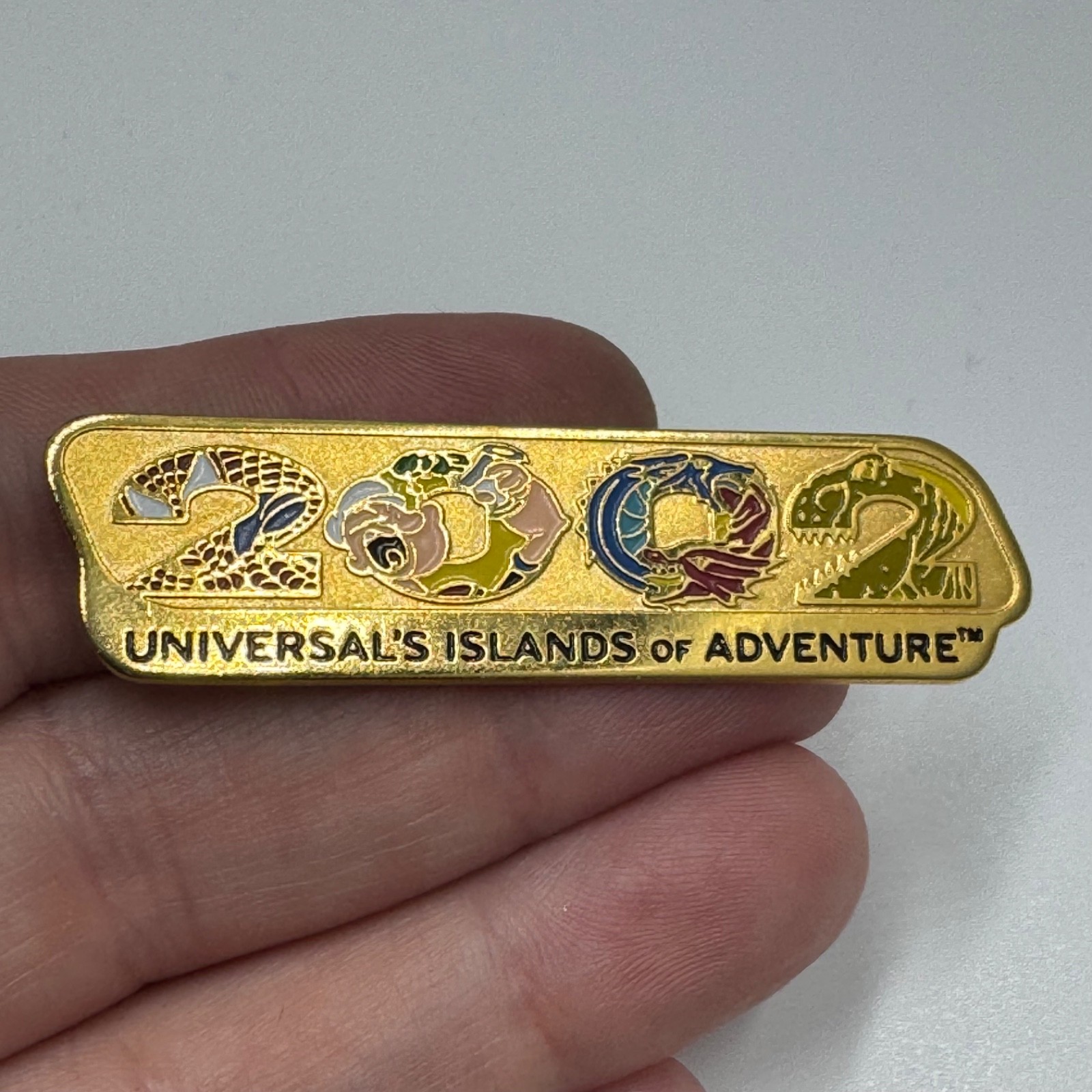 Vintage Universal Islands Of Adventure 2002 Lapel Pin Gold Tone Universal\'s Vintage Universal Islands Of Adventure 2002 Lapel Pin Gold Tone Universal\'s