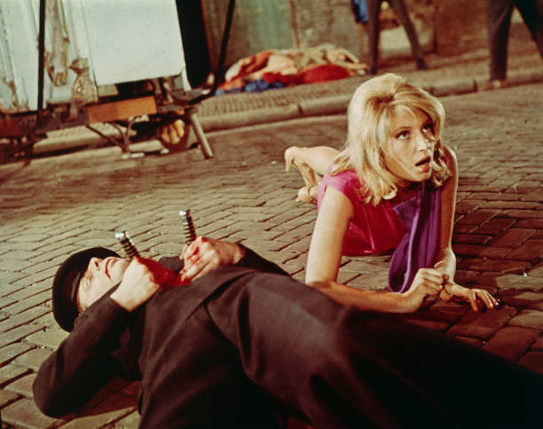 Italian actor Monica Vitti lies close to the ground beside a de - 1966 Old Photo