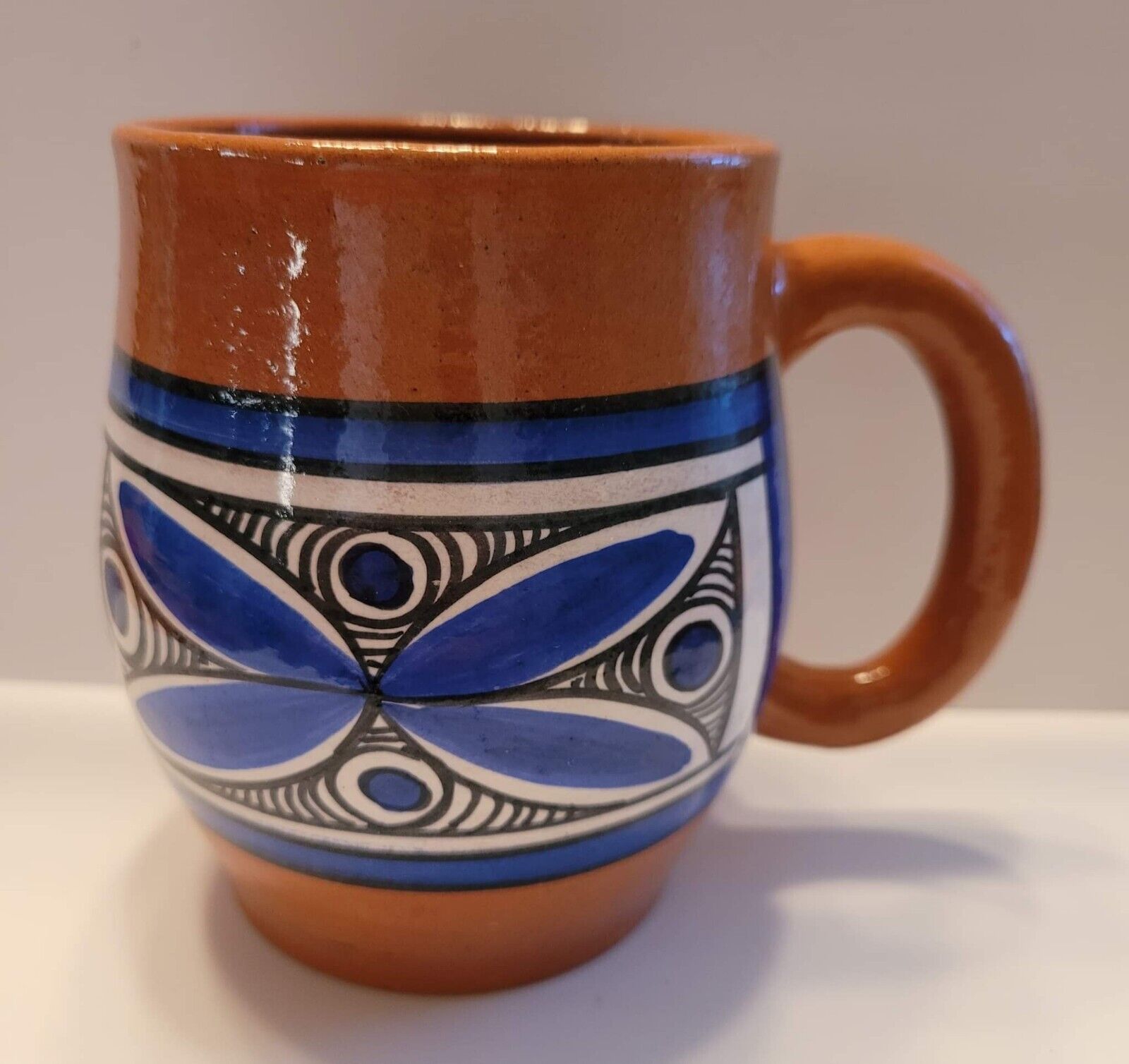 Hand Painted Ceramic Panama Mug Cobalt, white & black design on rust color glaze