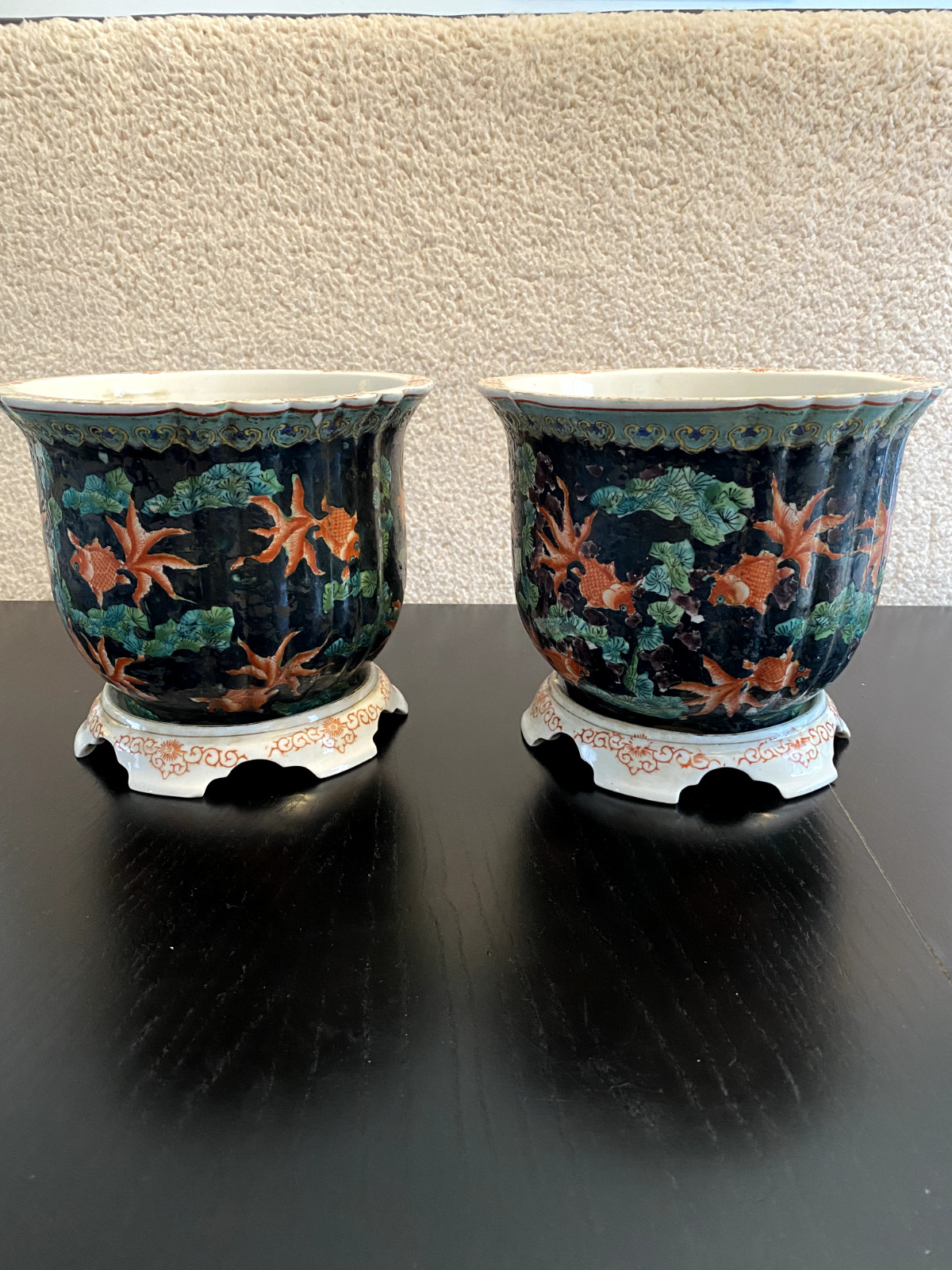 A pair of Chinese vintage black glazed porcelain pots painted w/ gold fish 