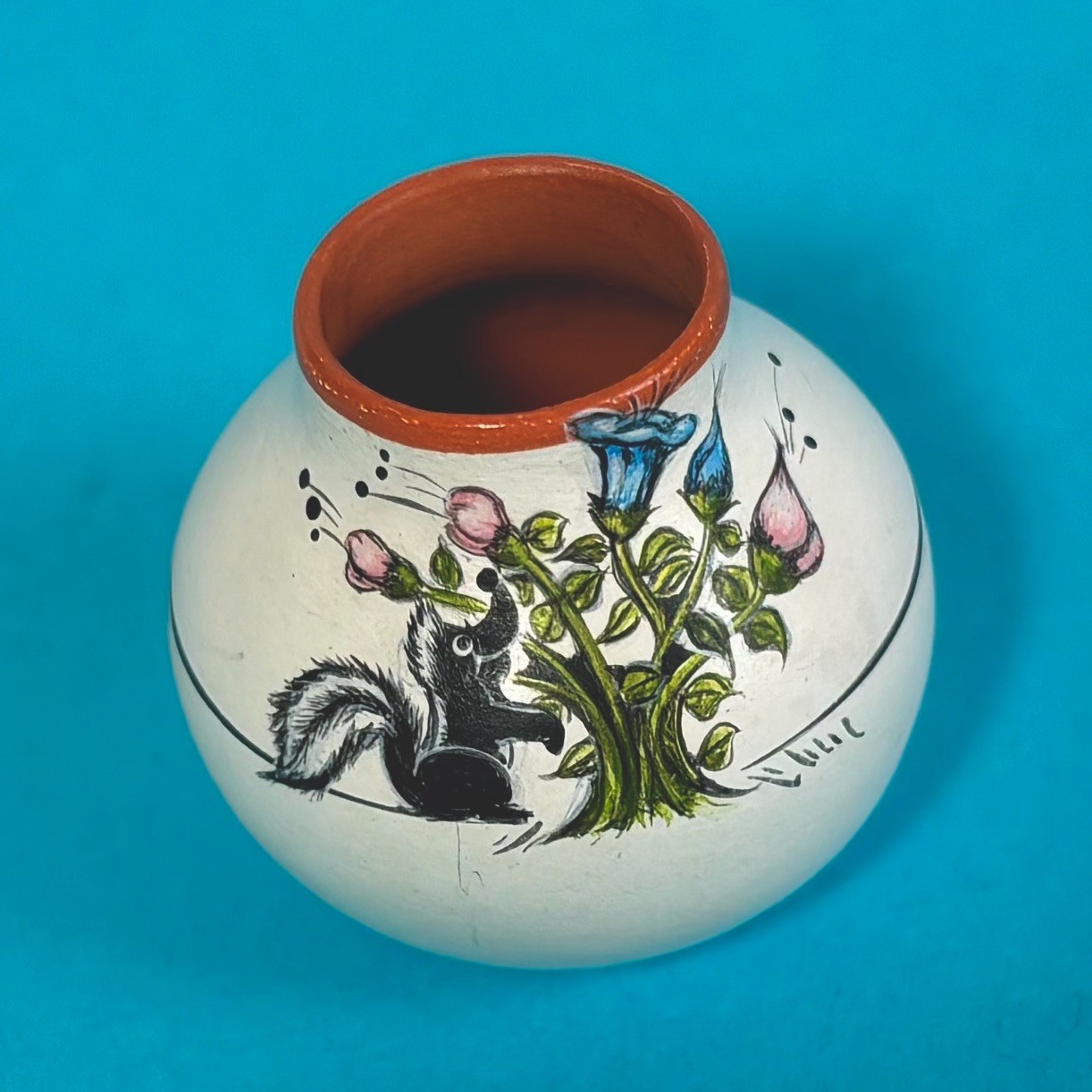 Theresa Wildflower, Chemehuevi Tribe, Miniature Pot Skunk Sniffing Flowers 1”