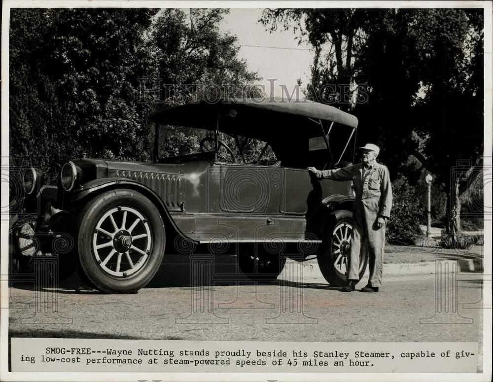 1966 Press Photo Wayne Nutting stands beside antique Stanley Steamer automobile.