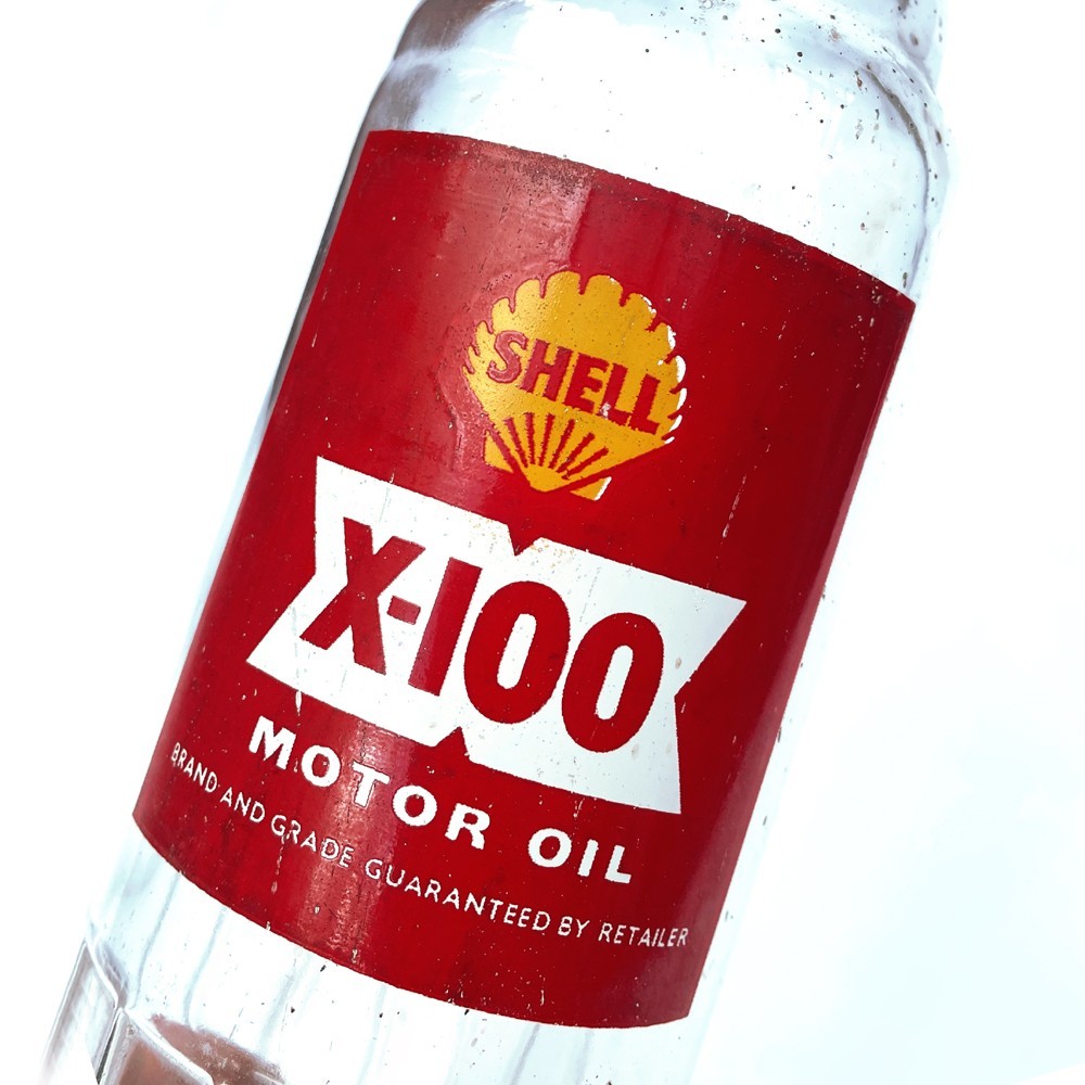 A FINE VINTAGE SHELL X-100 MOTOR OIL BOTTLE GARAGE STATION DISPLAY