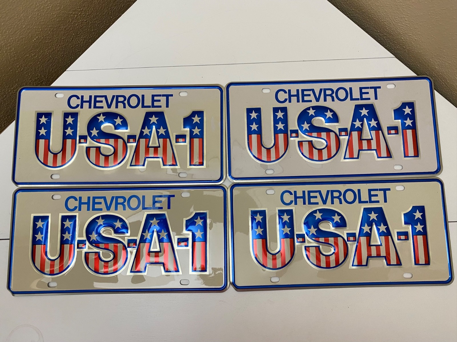 NOS Lot of 4 Original Chevrolet USA-1 License Plates – Patriotic Stars & Stripes