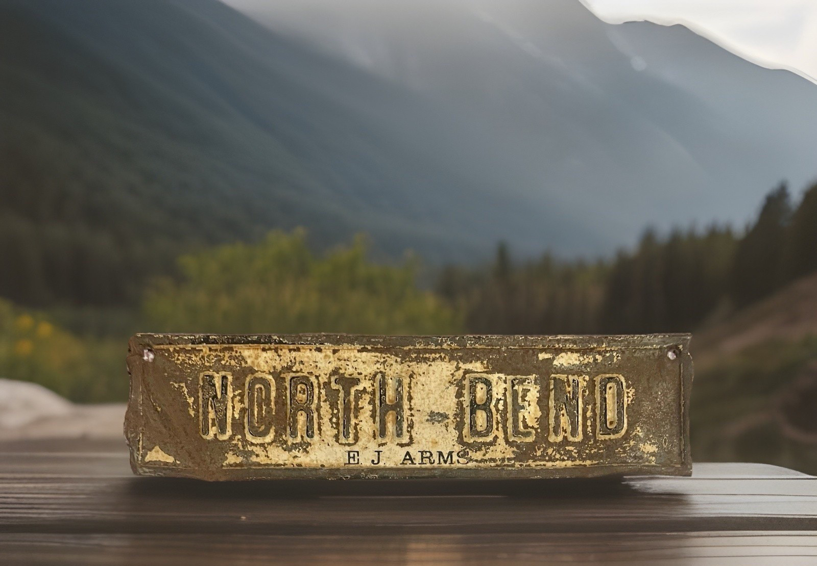 Vintage NORTH BEND E J ARMS Embossed Metal License Plate Topper