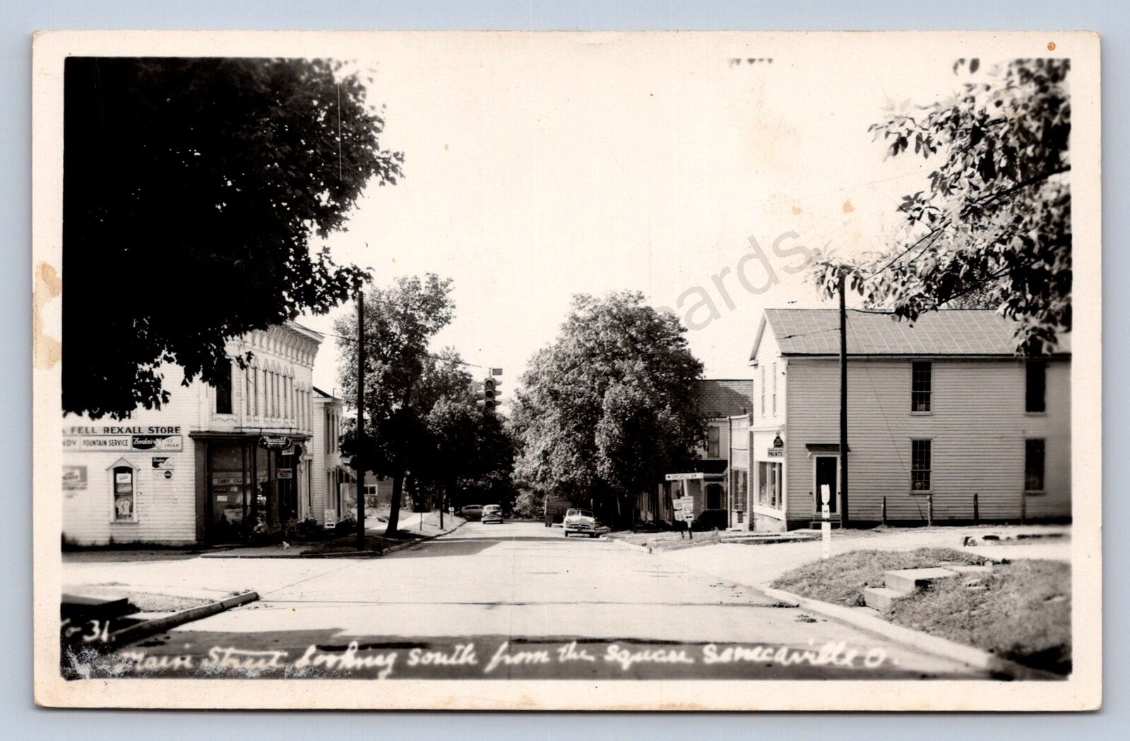 J87/ Senecaville Ohio RPPC Postcard c1940s Cambridge Main St Stores 1732