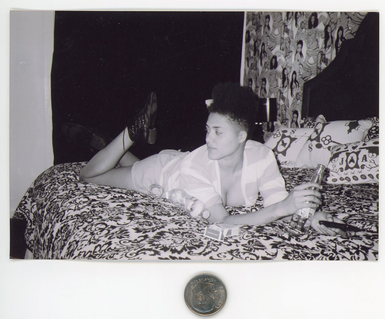 Old 1980\'s B&W photo / Young Black Woman on Bed with Beer Cigarettes & Remote