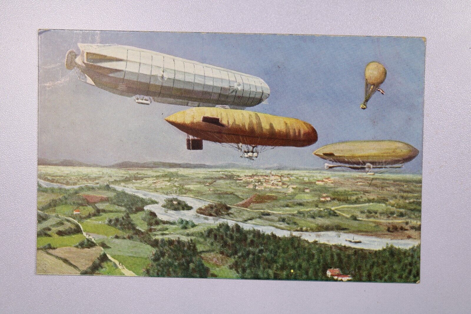 Vintage PPC Zeppelins Over A River - L38442
