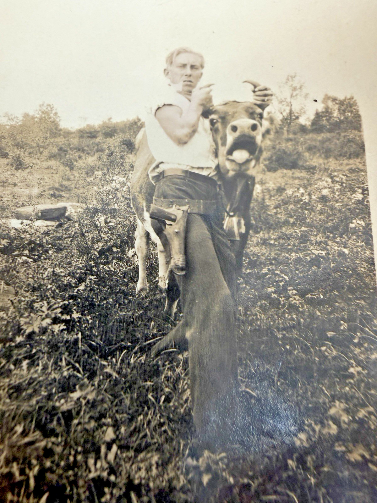 1930s Handsome Man Carrying a Cow with Gun Snapshot Photo antique