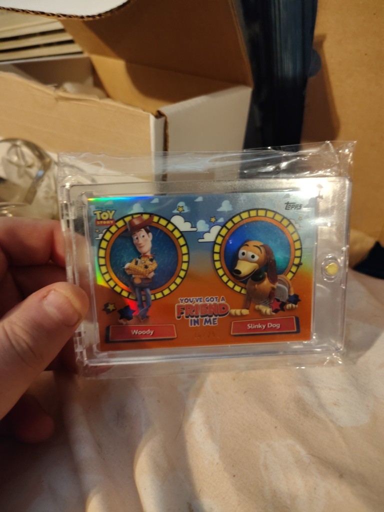 2025 Topps 30 Years Toy Story You\'ve Got Friend In Me Woody Slinky Dog Orange/25
